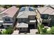 Aerial view of two-story home highlighting tile roof, solar panels, side courtyard, and well maintained landscaping at 9950 Coyote Echo Ct, Las Vegas, NV 89166