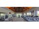 Well-equipped gym with state-of-the-art treadmills and weight training machines, and large windows overlooking the outside at 9950 Coyote Echo Ct, Las Vegas, NV 89166