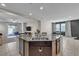 Open concept kitchen with granite countertops and stainless steel appliances at 9950 Coyote Echo Ct, Las Vegas, NV 89166