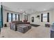 Spacious living room featuring a sectional sofa and comfortable seating arrangement at 9950 Coyote Echo Ct, Las Vegas, NV 89166