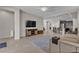 Spacious living area with tile flooring and a media center at 9950 Coyote Echo Ct, Las Vegas, NV 89166