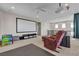 Upstairs recreational room features a large movie screen and comfortable seating at 9950 Coyote Echo Ct, Las Vegas, NV 89166