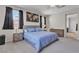 Serene main bedroom with a king-sized bed and neutral decor at 9950 Coyote Echo Ct, Las Vegas, NV 89166
