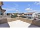 Exterior patio view showcases the rooftop of the house and the neighborhood at 9950 Coyote Echo Ct, Las Vegas, NV 89166