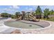 Community playground featuring slides, climbing structures and shade canopies at 9950 Coyote Echo Ct, Las Vegas, NV 89166