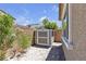 Backyard shed near well-manicured landscaping at 9950 Coyote Echo Ct, Las Vegas, NV 89166
