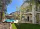 Lush backyard featuring a pool, patio, and upper balcony with a view at 10 Gulf Pines Ave, Las Vegas, NV 89148