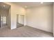Neutral bedroom boasts a mirrored closet, carpeted floor, recessed lights, and a large window at 10421 Linfield Pl, Las Vegas, NV 89134