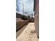 View of the property's backyard featuring a patio and block wall at 1081 Overture Dr, Las Vegas, NV 89123