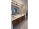 Bathroom featuring a dual sink vanity, framed mirror, and tile flooring at 1081 Overture Dr, Las Vegas, NV 89123