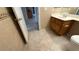 Bathroom featuring a single-sink vanity, toilet, and ceramic tile flooring at 1081 Overture Dr, Las Vegas, NV 89123