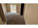 Bedroom with neutral carpet, sliding glass door, and an open closet at 1081 Overture Dr, Las Vegas, NV 89123