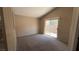 Bedroom featuring carpet flooring, ample natural light, and access to the backyard at 1081 Overture Dr, Las Vegas, NV 89123