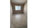 A bedroom with neutral paint and tile flooring, lit by a window at 1081 Overture Dr, Las Vegas, NV 89123