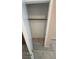Inside of a storage closet complete with tile flooring and closet rod for hanging clothes at 1081 Overture Dr, Las Vegas, NV 89123