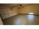 An empty two-car garage features finished walls and floor with automatic door at 1081 Overture Dr, Las Vegas, NV 89123