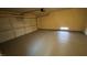 Spacious garage featuring a newly painted epoxy floor and an automatic door at 1081 Overture Dr, Las Vegas, NV 89123