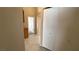 Hallway with closet and view to open door showing cabinet and door at 1081 Overture Dr, Las Vegas, NV 89123
