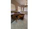 A kitchen sink with tiled countertops, stainless steel dishwasher, and tile flooring at 1081 Overture Dr, Las Vegas, NV 89123