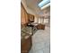 The kitchen features tiled countertops, stainless steel appliances, and ample counter space at 1081 Overture Dr, Las Vegas, NV 89123