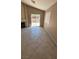 Comfortable living room with tiled flooring, a fireplace, and access to the backyard at 1081 Overture Dr, Las Vegas, NV 89123