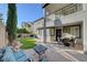 Lush backyard showcasing a well-maintained lawn, patio area, and stylish home architecture at 11417 Rock Cove Way, Las Vegas, NV 89141