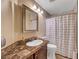 Bathroom with vanity, an oval sink, and a shower at 11417 Rock Cove Way, Las Vegas, NV 89141