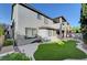 Rear view of the house highlighting the patio and artificial turf backyard at 11417 Rock Cove Way, Las Vegas, NV 89141