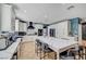 Modern kitchen featuring a large island, white cabinetry, and stainless steel appliances at 11417 Rock Cove Way, Las Vegas, NV 89141