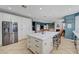 Bright, spacious kitchen features a large center island with marble counters and white cabinetry at 11417 Rock Cove Way, Las Vegas, NV 89141