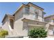 Two-story home with stucco exterior and a tile roof with desert landscaping at 11577 Vesuvio Ct, Las Vegas, NV 89183