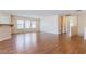 Spacious living room with wood flooring and natural light at 11577 Vesuvio Ct, Las Vegas, NV 89183