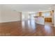 Open concept living space with wood flooring and lots of windows at 11577 Vesuvio Ct, Las Vegas, NV 89183