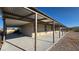 Single-story home with long covered patio and desert landscaping on a bright day at 1180 Lava Ave, Jean, NV 89019