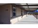 Spacious home exterior with covered porch, desert views, and ample natural light through multiple windows at 1180 Lava Ave, Jean, NV 89019