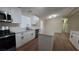 Updated kitchen with stainless steel appliances, modern island and laminate wood floors at 1180 Lava Ave, Jean, NV 89019