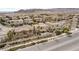 A serene aerial shot of a home with a pool, set against a backdrop of desert landscaping and distant mountains at 12116 Vista Linda Ave, Las Vegas, NV 89138