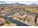 Stunning aerial view of a residential area showcasing well-kept homes, a park, and picturesque mountain views at 12116 Vista Linda Ave, Las Vegas, NV 89138