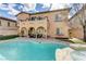 Inviting backyard showcasing a refreshing pool, a covered patio, and well-manicured landscaping for outdoor enjoyment at 12116 Vista Linda Ave, Las Vegas, NV 89138