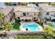 Relaxing backyard featuring a custom-designed pool and spa, lush landscaping, and an arched patio, perfect for outdoor living at 12116 Vista Linda Ave, Las Vegas, NV 89138