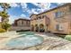 Beautiful backyard featuring a pool, spa and covered outdoor seating area, perfect for relaxing and entertaining at 12116 Vista Linda Ave, Las Vegas, NV 89138