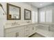 Elegant bathroom featuring a double vanity, natural light and glass enclosed shower at 12116 Vista Linda Ave, Las Vegas, NV 89138