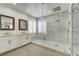 Modern bathroom with a glass-enclosed shower, double vanity, and elegant finishes at 12116 Vista Linda Ave, Las Vegas, NV 89138