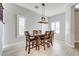 Inviting dining area featuring a dark wood table and stylish chairs creating a perfect setting for Gathering meals at 12116 Vista Linda Ave, Las Vegas, NV 89138