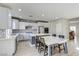 Spacious kitchen featuring white cabinets, granite countertops, and seamlessly connected to dining area making it perfect for gatherings at 12116 Vista Linda Ave, Las Vegas, NV 89138