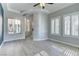 Bright living room with hardwood floors, plantation shutters, and abundant natural light showcasing the home's inviting atmosphere at 12116 Vista Linda Ave, Las Vegas, NV 89138
