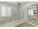 Modern bathroom featuring a large glass shower, double vanity, and elegant finishes at 12116 Vista Linda Ave, Las Vegas, NV 89138