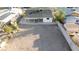 An aerial view shows a spacious backyard, patio, and surrounding fence, offering privacy and outdoor space at 1436 Chestnut St, Henderson, NV 89011