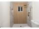 This remodeled bathroom boasts modern gold fixtures, marbled tile, and updated plumbing at 1436 Chestnut St, Henderson, NV 89011