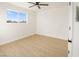 Cozy bedroom with a ceiling fan, LVP flooring, and a bright window view at 1436 Chestnut St, Henderson, NV 89011